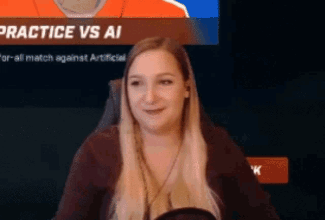 a woman is sitting in front of a screen with the words practice vs ai on it