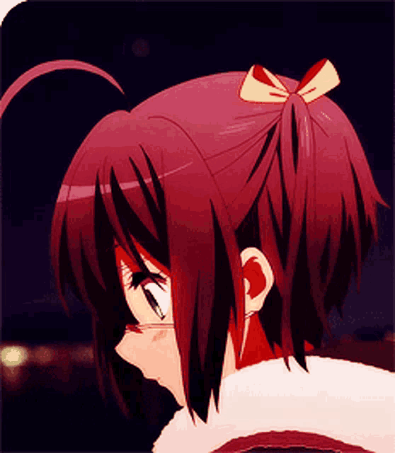 a girl with red hair has a bow on her hair