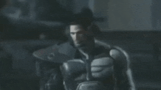 a man in a superhero costume is standing in a dark room holding a sword .
