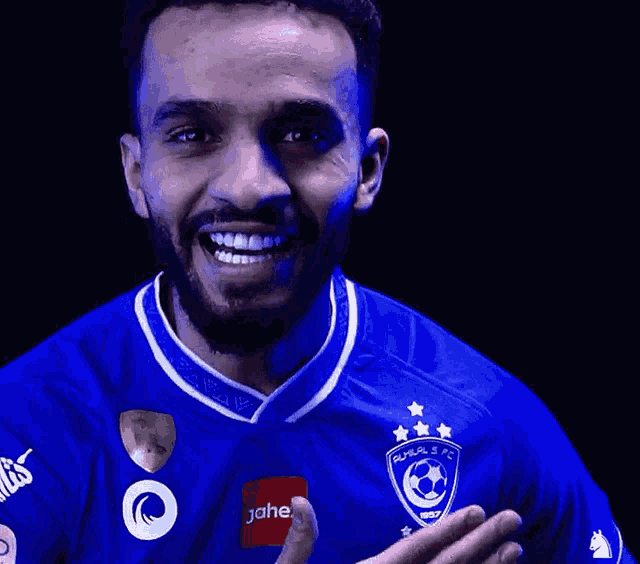 a man wearing a blue shirt that says jahe