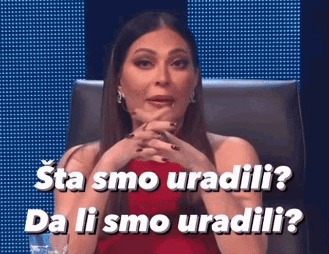 a woman in a red dress is sitting in a chair with the words " sta smo uradili da li smo uradili "