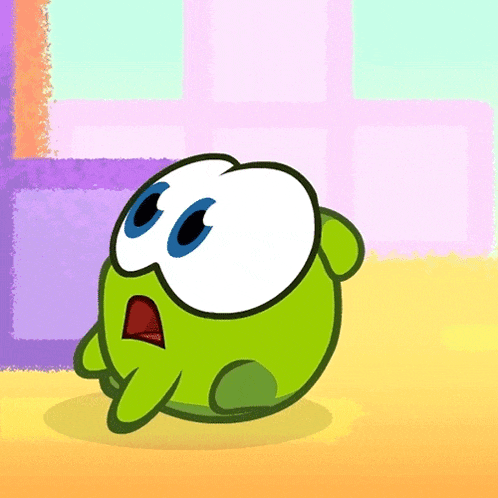 a green cartoon character with big blue eyes looks surprised