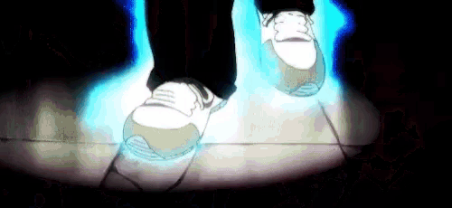 a person 's feet are walking on a tiled floor in a dark room .