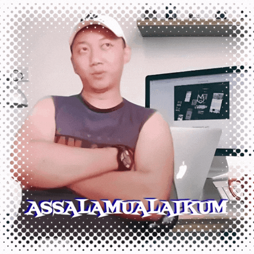 a man with his arms crossed is standing in front of a computer with the words assalamualaikum written on the bottom