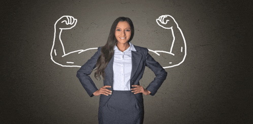 a woman in a suit has her hands on her hips with a drawing of her muscles behind her