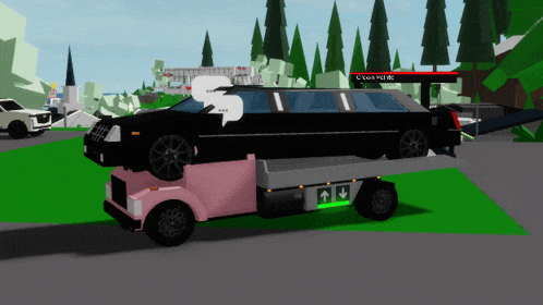 a black limousine is being towed by a pink tow truck that says c. cole hotel