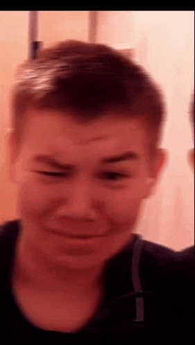 a close up of a person 's face with a blurred background
