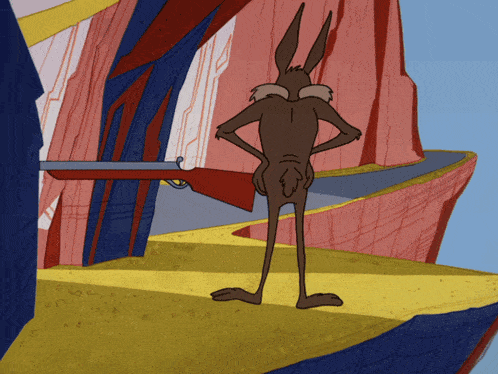 a cartoon coyote is holding a gun in front of a canyon