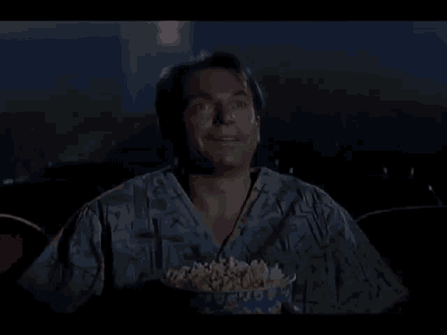 Sam Neill Watching Movie GIF - Sam Neill Watching Movie Popcorn GIFs