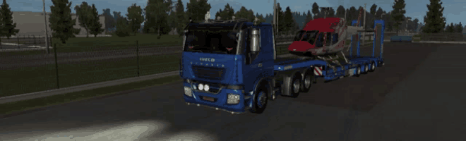 a blue truck with the word iveco on the side