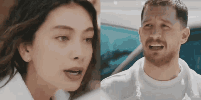 a man and a woman are standing next to each other in front of a car and talking to each other .