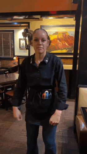 a woman wearing a black shirt with the word army on the front