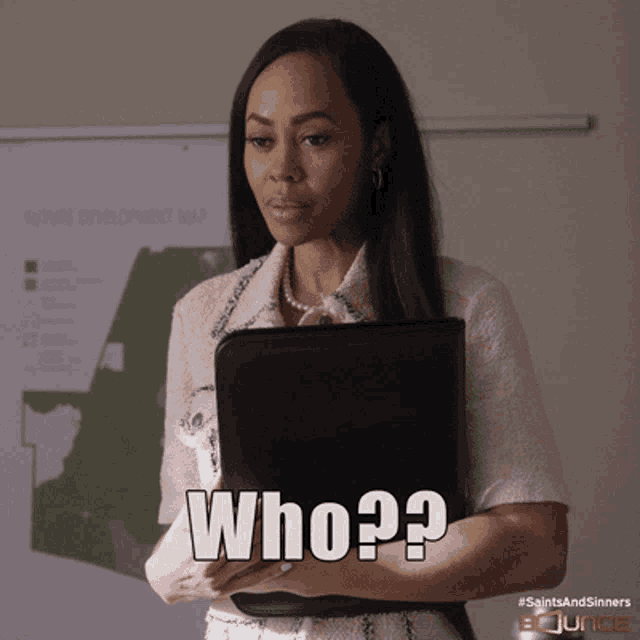 a woman is holding a briefcase and says who