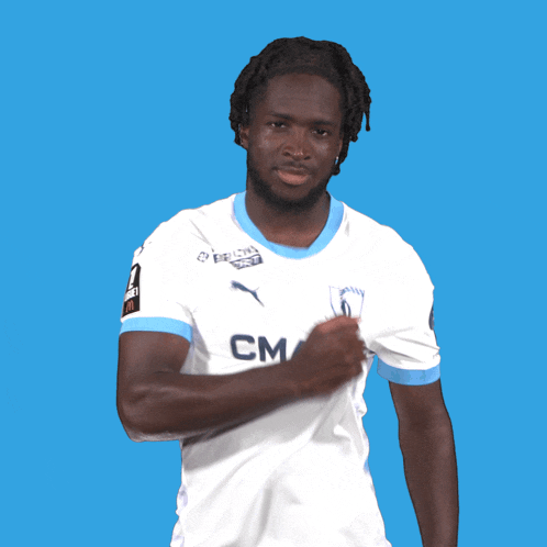 a man wearing a white shirt with cm on the front