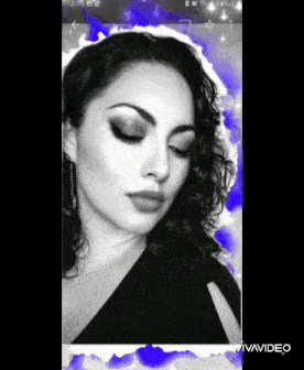 a black and white photo of a woman with vivavideo written on the bottom right corner