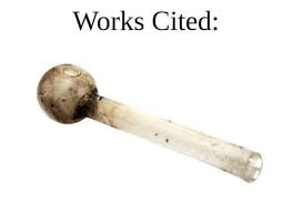 a close up of a dirty glass pipe with the words `` works cited '' written on it .