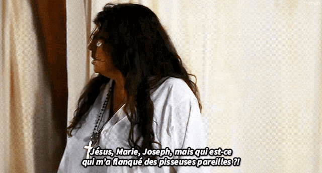 a woman in a white shirt says jesus marie joseph mais qui est-ce qui m'a flanque des pisseuses parelles
