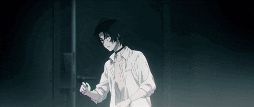 a man with a choker around his neck is standing in the dark