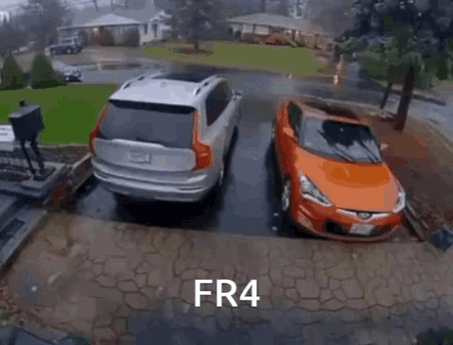 a canoe is stuck between two cars in a driveway and the words fr4 are on the bottom of the picture