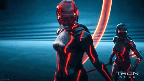 a poster for tron ares shows two women in futuristic costumes