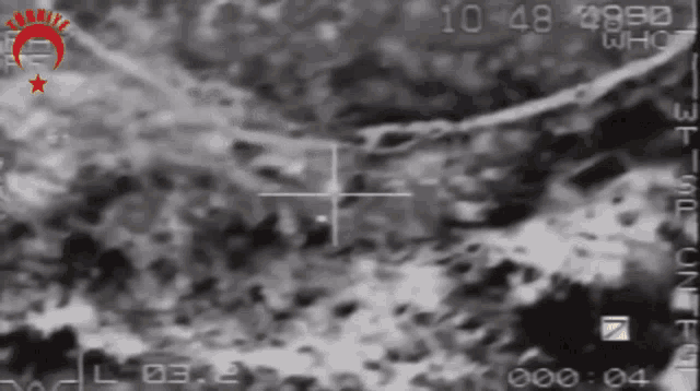 a black and white photo of a landscape with the time 10:48