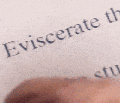 a person is holding a piece of paper that says " iscerate the tu "