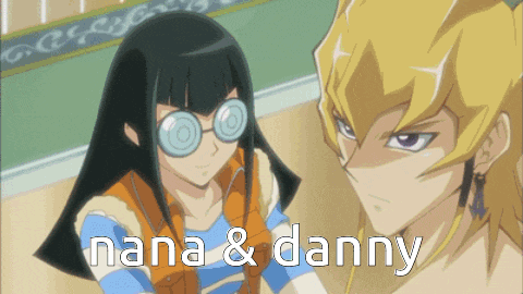 nana and danny are two anime characters standing next to each other in a room