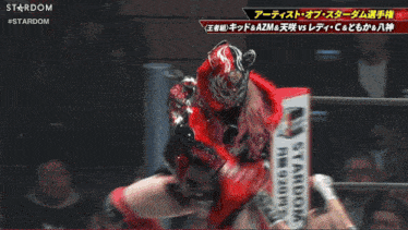 a wrestling match between starlight kid and azm is shown