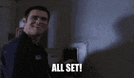 a man is smiling and saying `` all set '' .