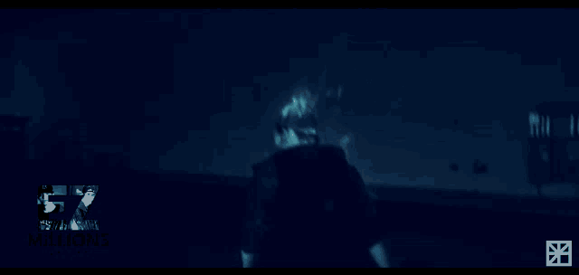 a person is standing in a dark room with the words 5 million written on the bottom