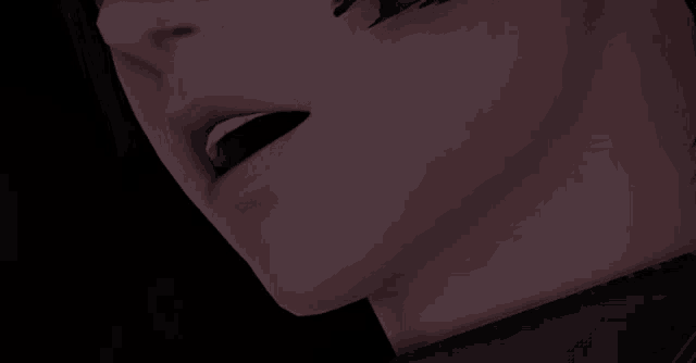 a close up of a person 's mouth and neck