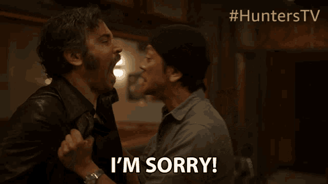 a man says i 'm sorry while holding another man 's arm