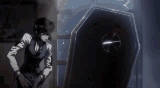 a man in a suit is standing next to a coffin in a dark room