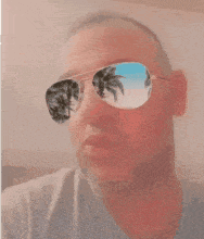 a man wearing sunglasses and the name alex on his face