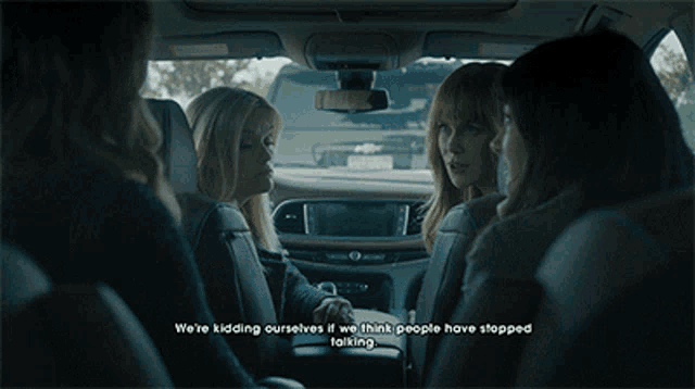 a group of women are sitting in a car with the words we 're kidding ourselves
