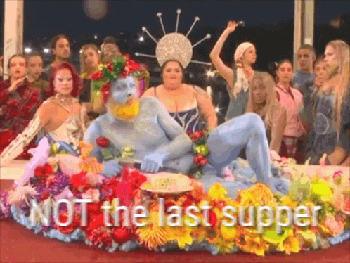 a group of people are gathered around a statue with the words not the last supper
