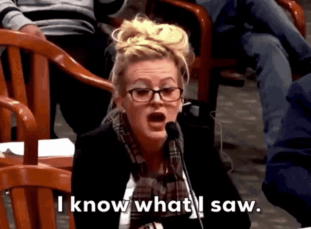 a woman speaking into a microphone with the words " i know what i saw " below her