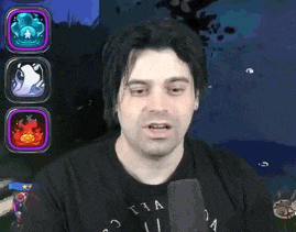 a man in a black shirt is talking into a microphone in front of a video game screen .