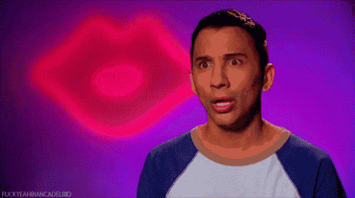 a man with a surprised look on his face is standing in front of a pink and purple background .