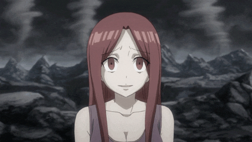 a girl with red hair is standing in front of a mountain range