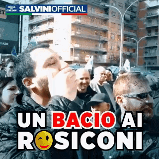 a group of people are gathered in front of a sign that says salvini official