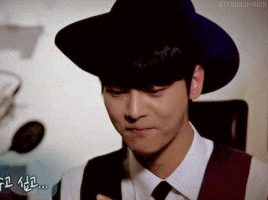a man wearing a black hat and a white shirt has the word otto on the bottom right