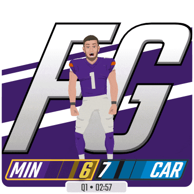 a football player in a purple jersey stands in front of a fg logo