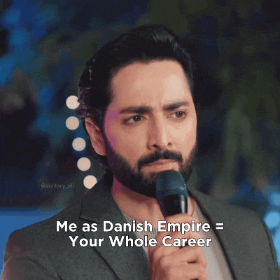 a man with a beard is holding a microphone and says " me as danish empire "