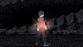 a blurry image of a person standing in the dark with a red light coming out of their chest .