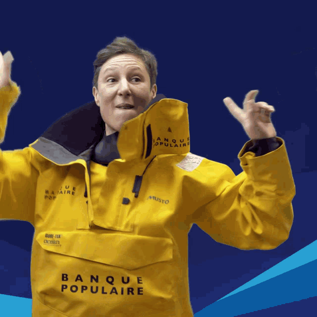 a man wearing a yellow jacket with banque populaire written on it