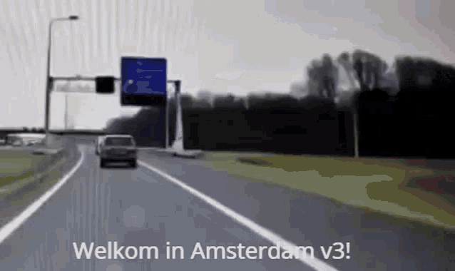 a car is driving down a highway with welkom in amsterdam v3 written on the bottom