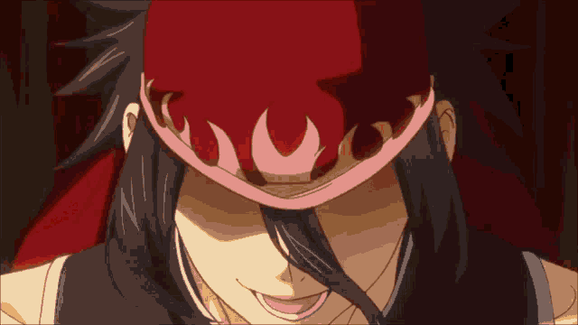 a close up of a person wearing a hat with flames on it