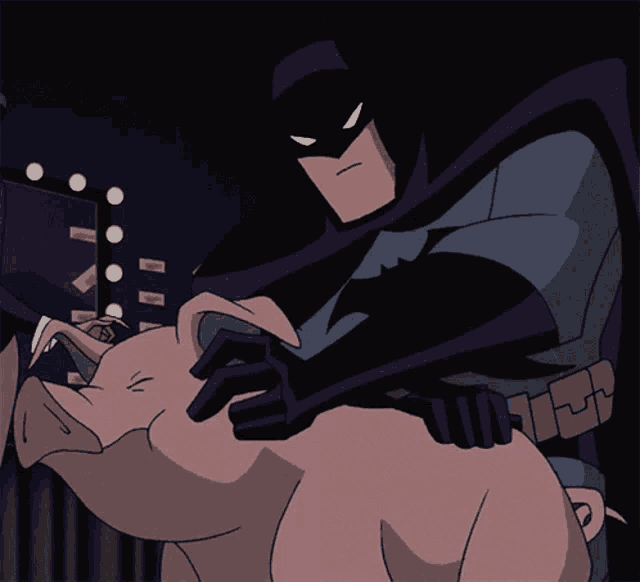 a cartoon of batman holding a pink pig in his arms