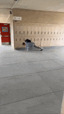 a person doing push ups in front of lockers with the number 10-13
